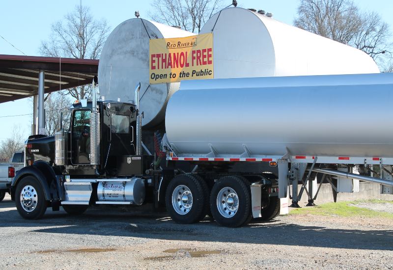 Red River Oil Company's Truck Delivering Fuel to a Commercial Business in Texas & Arkansas